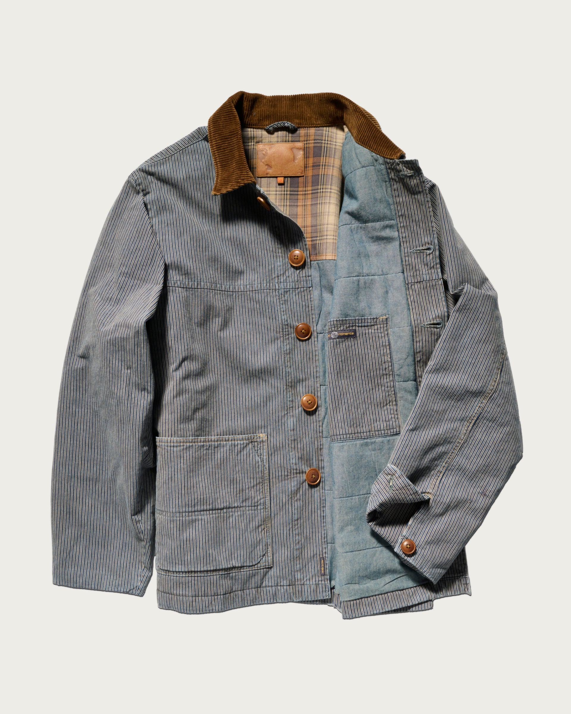 Blue corduroy jacket with plaid lining on a white background